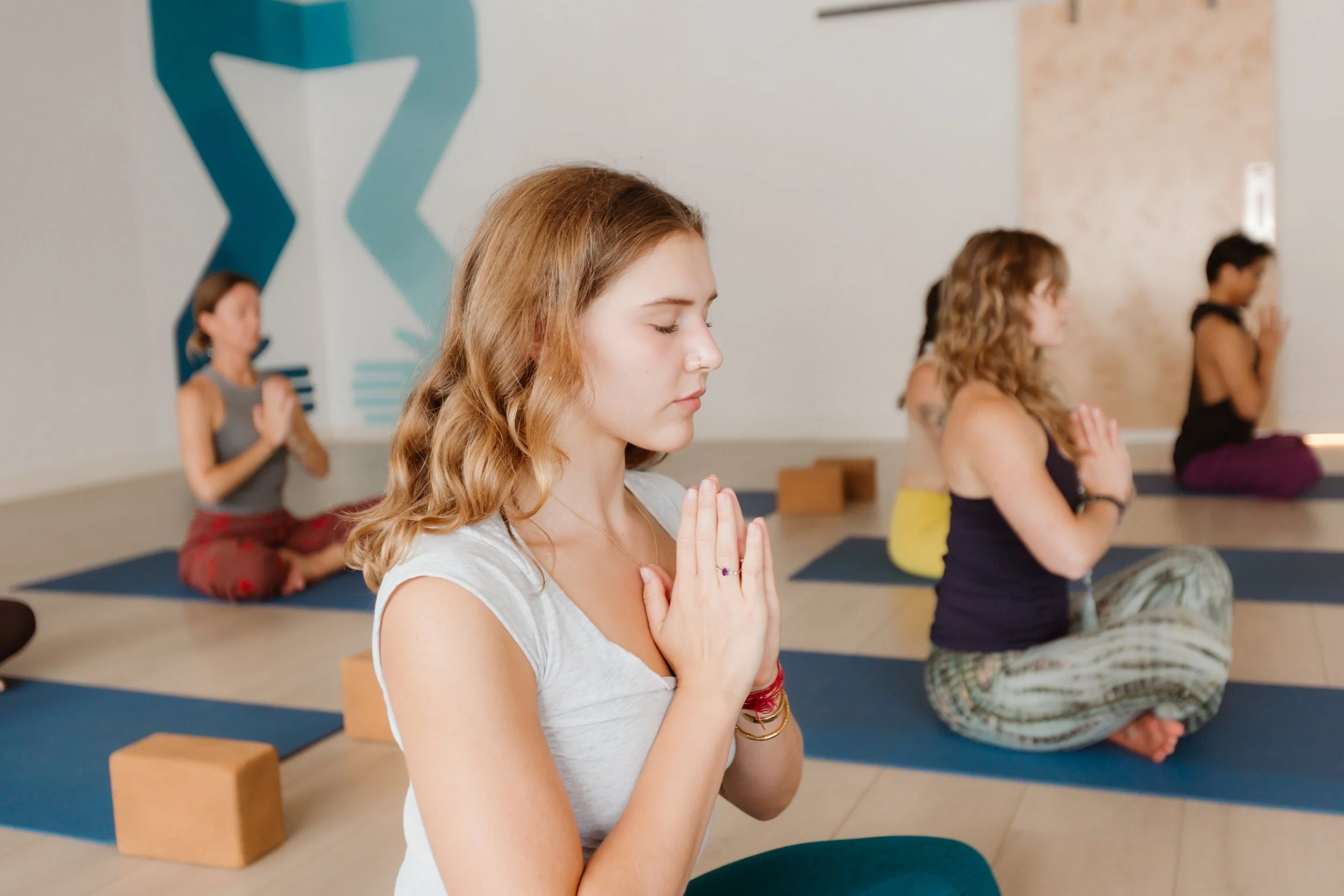 People practicing yoga together in Union’s studio